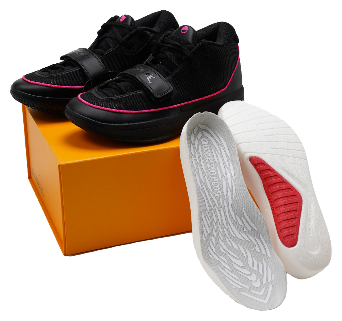 Black lace-up basketball shoes with pink trim and white-and-red outsole view