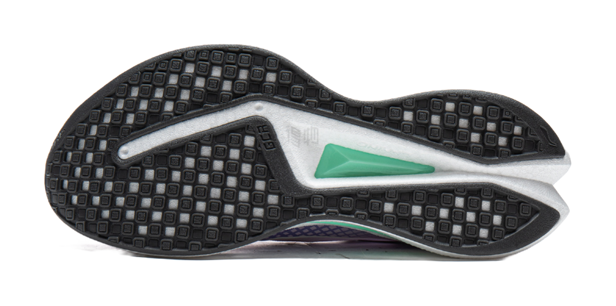 Black rubber outsole for lavender purple and white running shoe with green insert