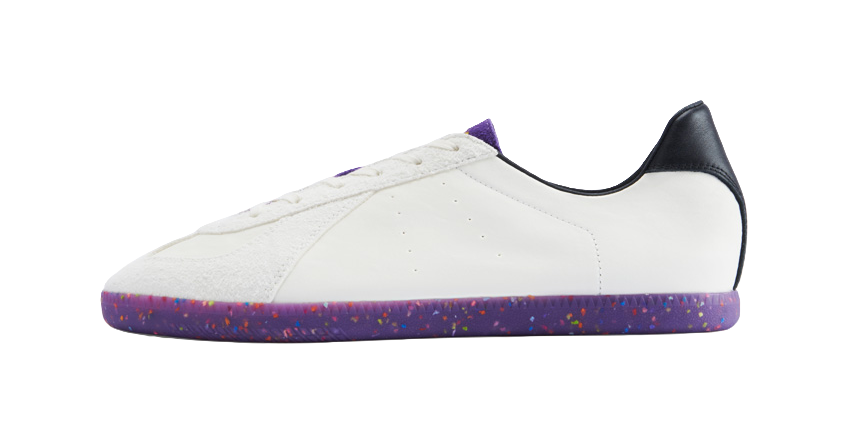 Low-top training shoes in white with purple speckled sole and heel panel