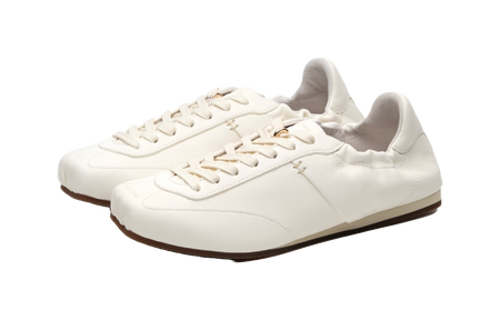 Antique white low-top trainers, angled view showing lace-up top and thin sole