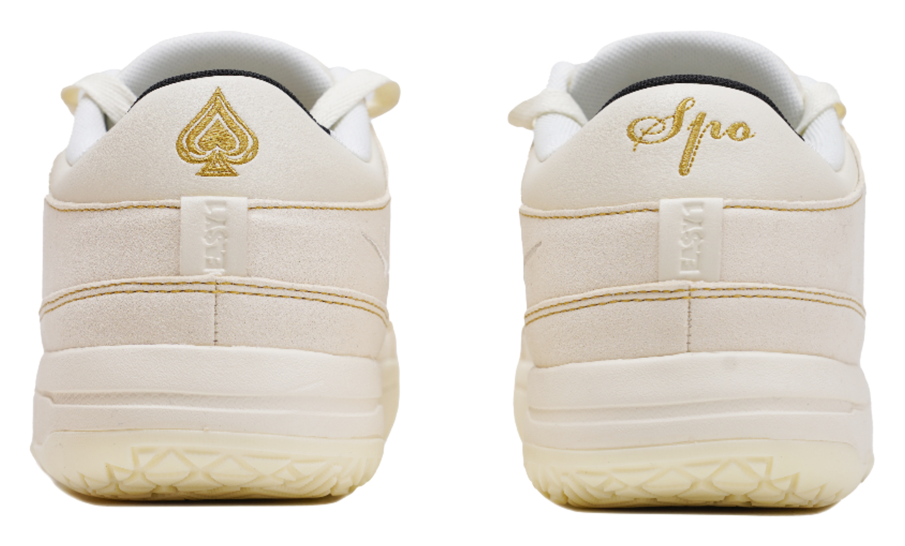 Cream sneaker heels with gold Spade logo and padded back tabs