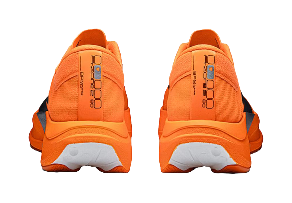 Orange running shoes heel view with molded back panel, cushioned collar, lace loops.