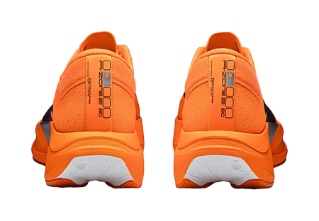 Orange running shoes heel view with molded back panel, cushioned collar, lace loops.