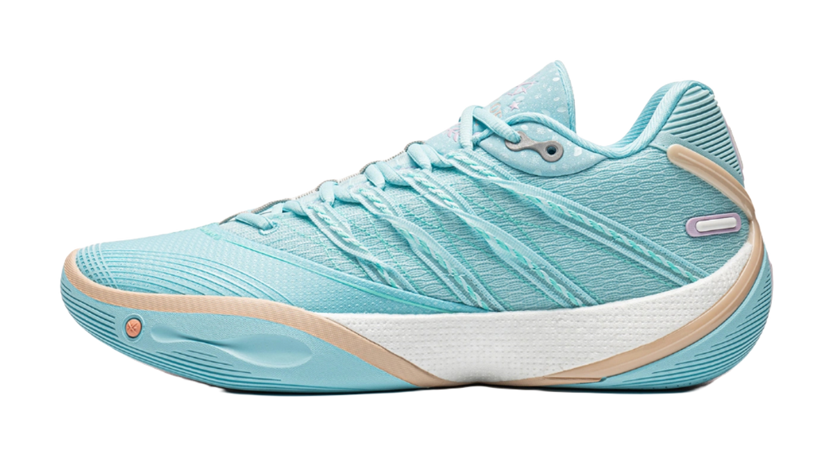 Light blue low basketball shoe with lace-up front and cushioned midsole