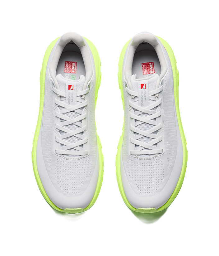 Mens low-top sneakers, light gray upper with neon green outsole and lace-up