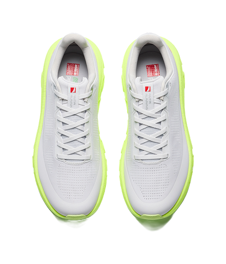 Mens low-top sneakers, light gray upper with neon green outsole and lace-up
