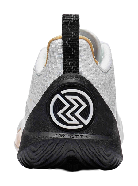 Black heel cup and white knit upper on a basketball shoe with gold-trimmed collar
