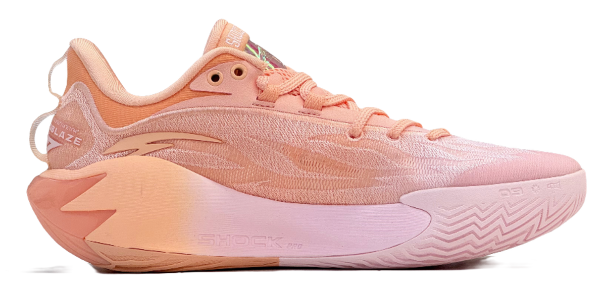 Pink and orange basketball shoe with SHOCK PRO midsole and zigzag traction
