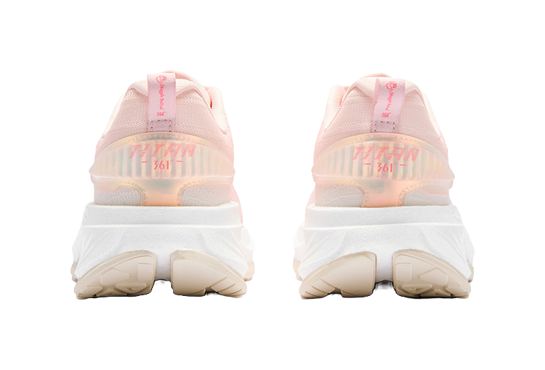 Women's low-top running shoes, pink and white, padded heel with branding on back