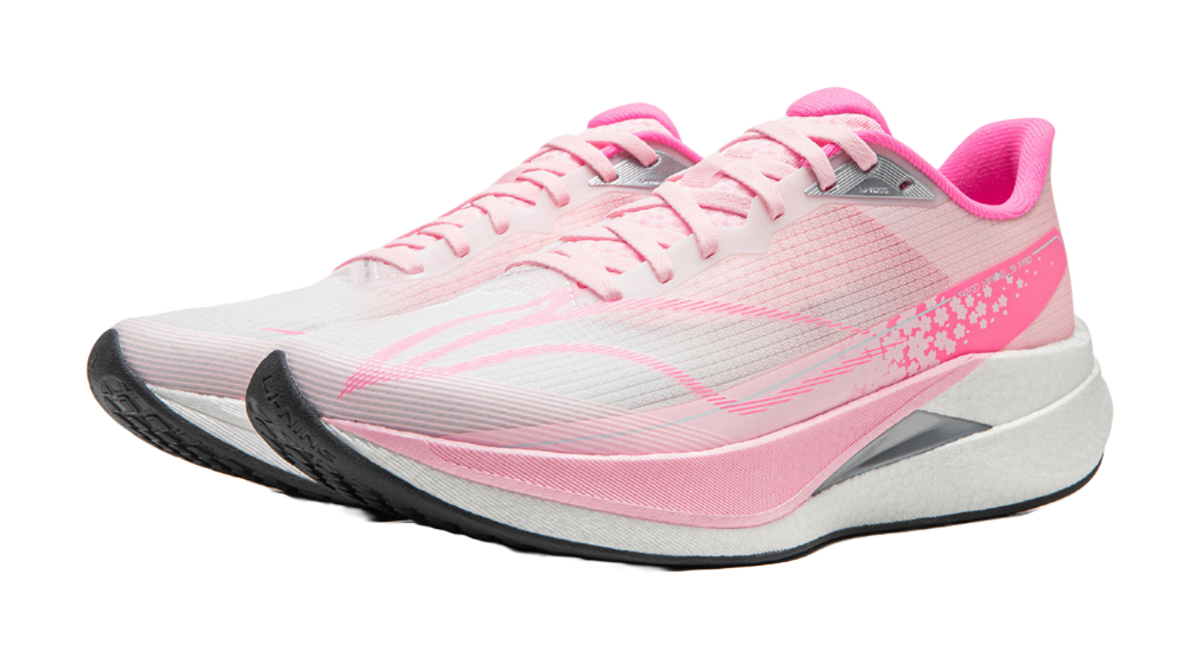 Pink running shoe front view with white laces, gray midsole, pink accent details