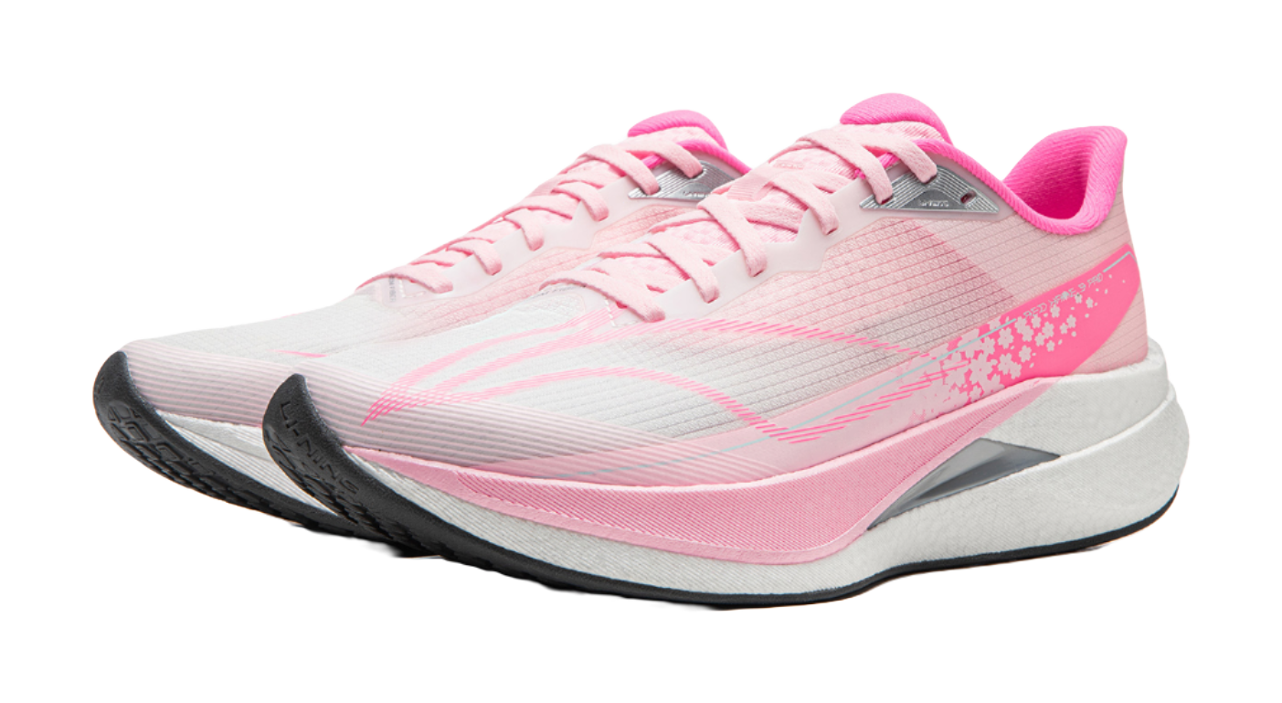Pink running shoe front view with white laces, gray midsole, pink accent details
