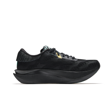 Women’s black running shoe side view with green accent stripe and sculpted sole.