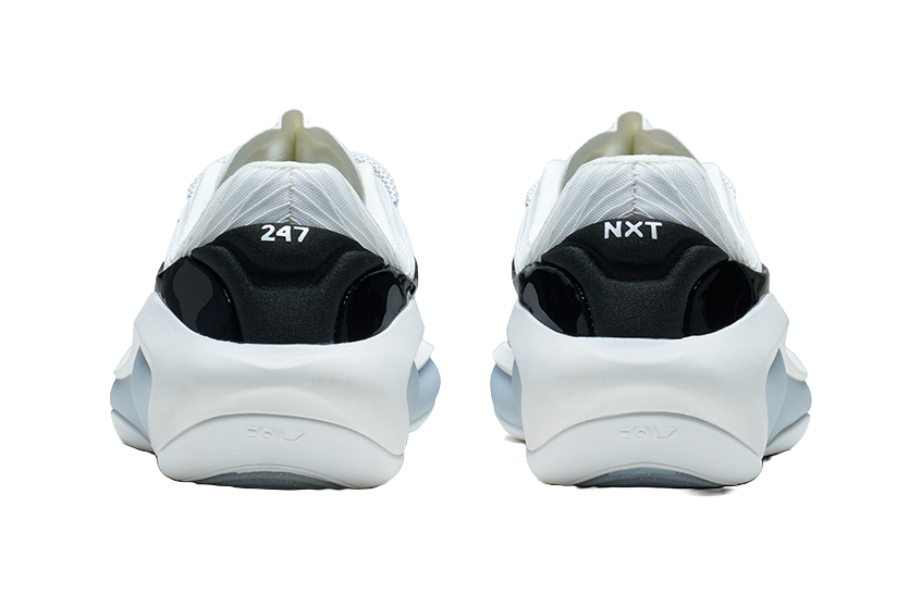 White and black basketball shoe, back view showing heel branding and tabs