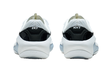 White and black basketball shoe, back view showing heel branding and tabs
