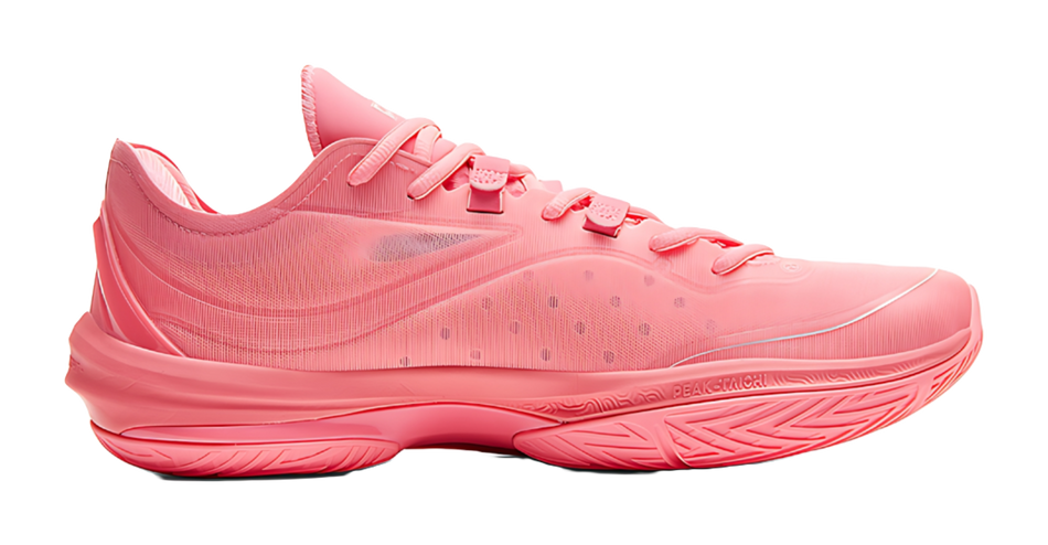 Red basketball shoe side view with textured upper and molded logo