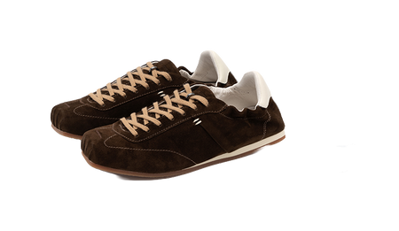 Women's dark brown suede low-top shoes in angled view with lace-up front and white heel tab