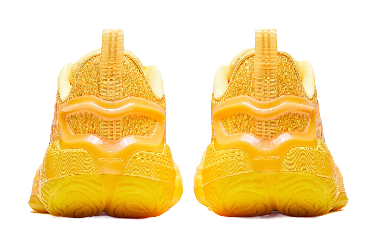 Yellow basketball shoe heels with thick tread and cushioned back collar