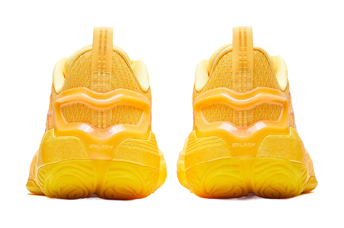Yellow basketball shoe heels with thick tread and cushioned back collar