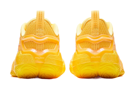 Yellow basketball shoe heels with thick tread and cushioned back collar