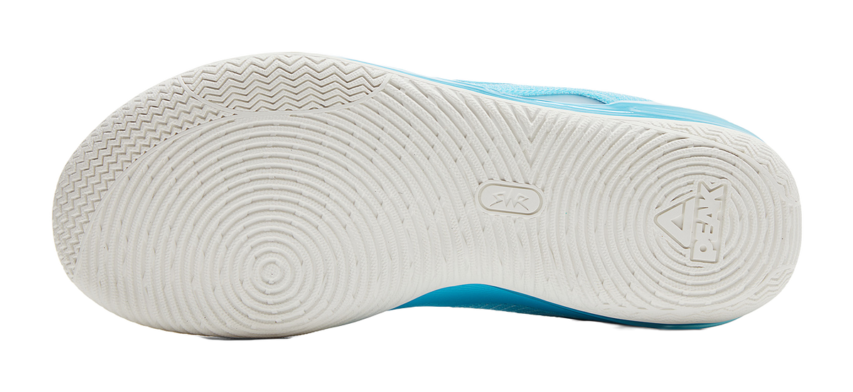 White outsole with blue edge and basketball tread pattern