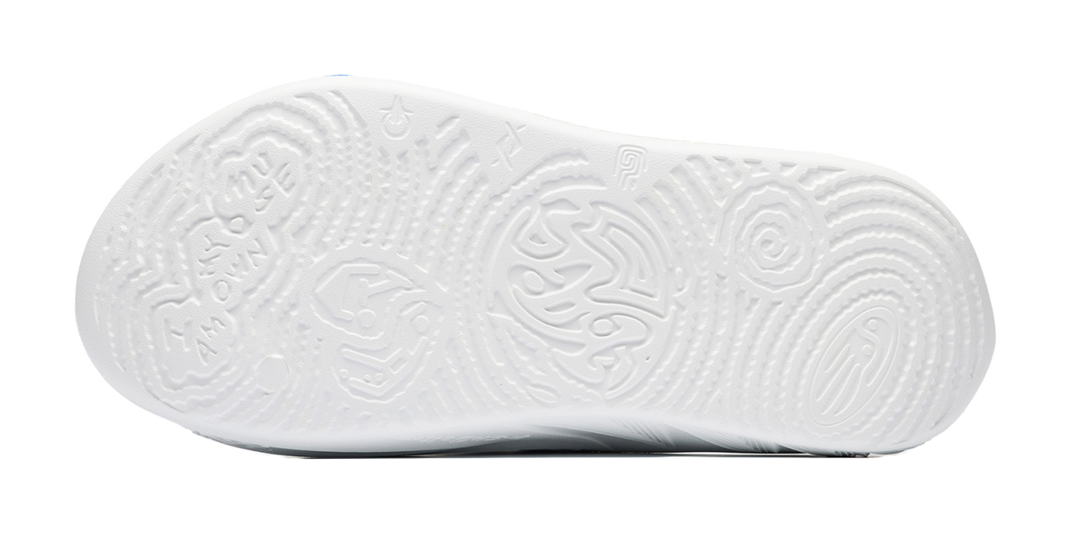 White slide sandal outsole with textured grip pattern