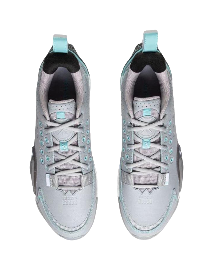 Pair of gray blue basketball shoes with white laces and teal collar lining