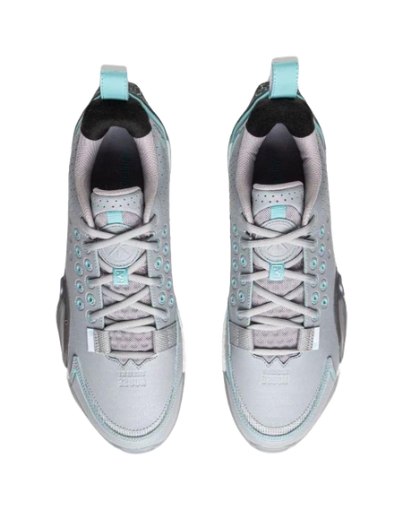 Pair of gray blue basketball shoes with white laces and teal collar lining