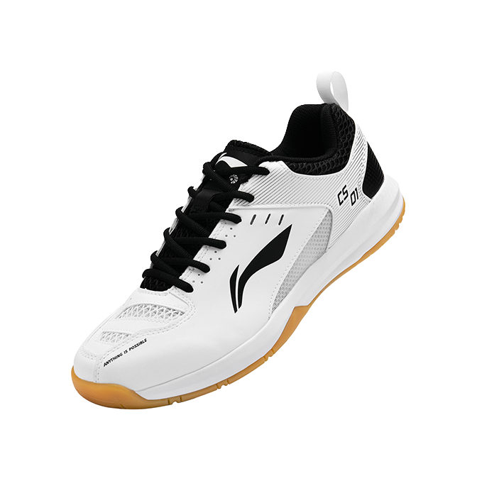 Unisex badminton shoe in white and black with orange gum outsole, side profile