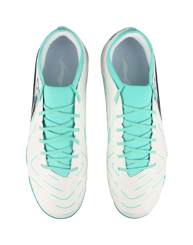 Pair of unisex soccer cleats: white uppers with teal collars and laces, TF studs
