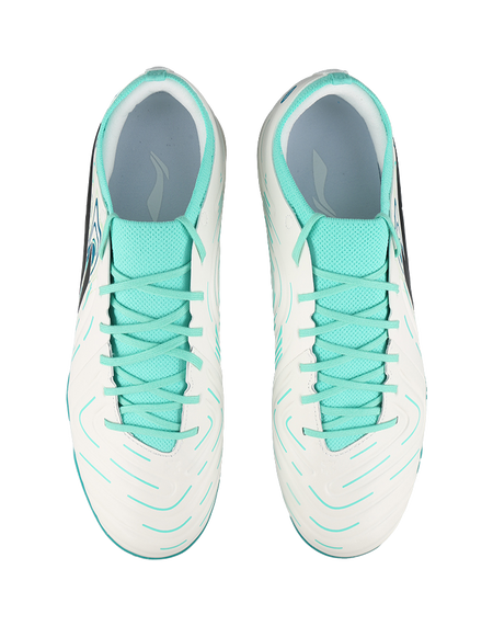 Pair of unisex soccer cleats: white uppers with teal collars and laces, TF studs