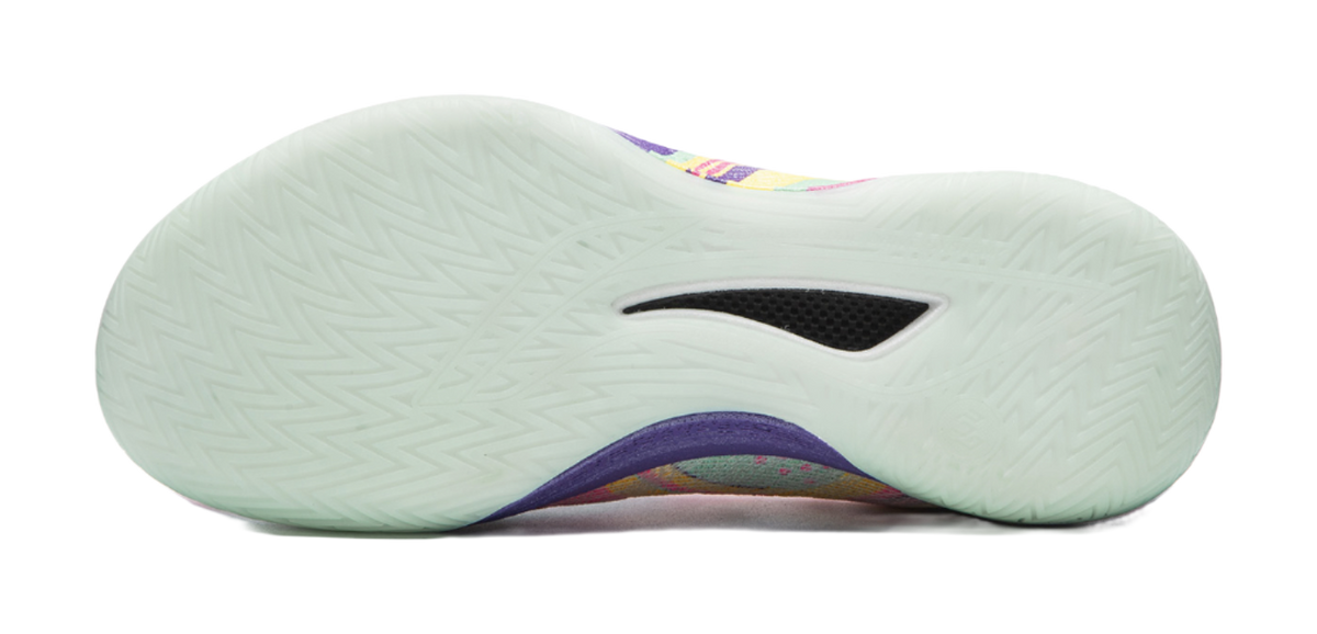 Basketball shoe outsole side profile with mint rubber tread and dark logo panel.