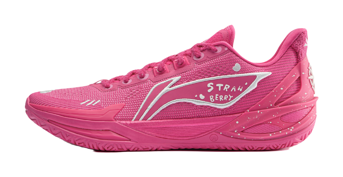 Pink low-top basketball shoe with mesh panels, white side logo and strawberry graphics.