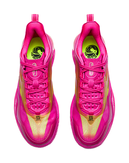 Pair of pink basketball shoes with lace-up vamps and green logo lining