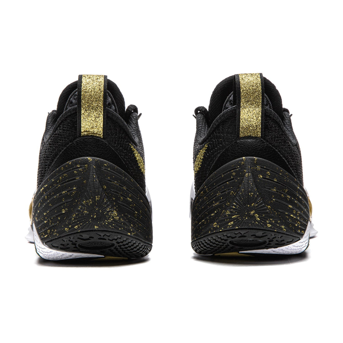 Black basketball shoe pair with gold heel straps and speckled sole pattern