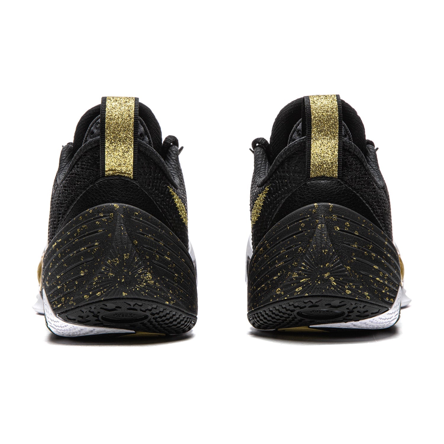 Black basketball shoe pair with gold heel straps and speckled sole pattern