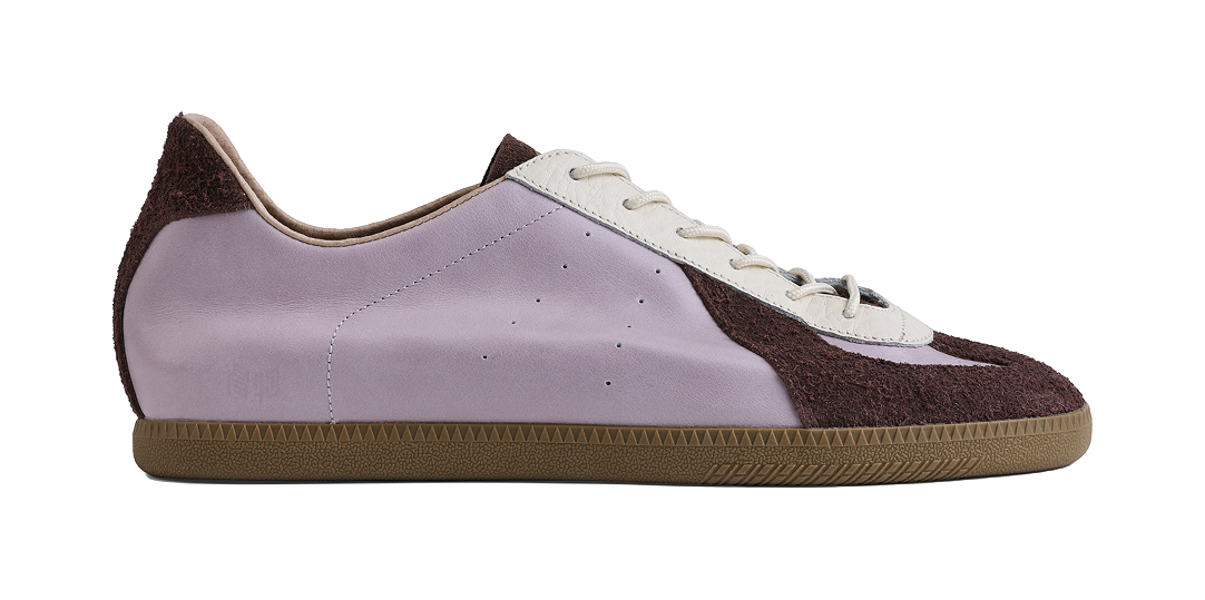 Lavender low-top sneaker with dark brown toe and side panels, white lace-up, gum sole