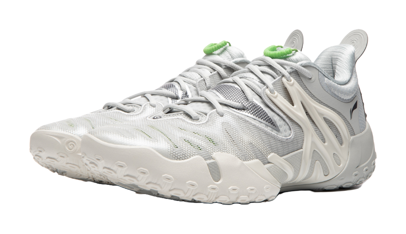 Unisex basketball shoe side view, white knit upper with light gray panels and green trim