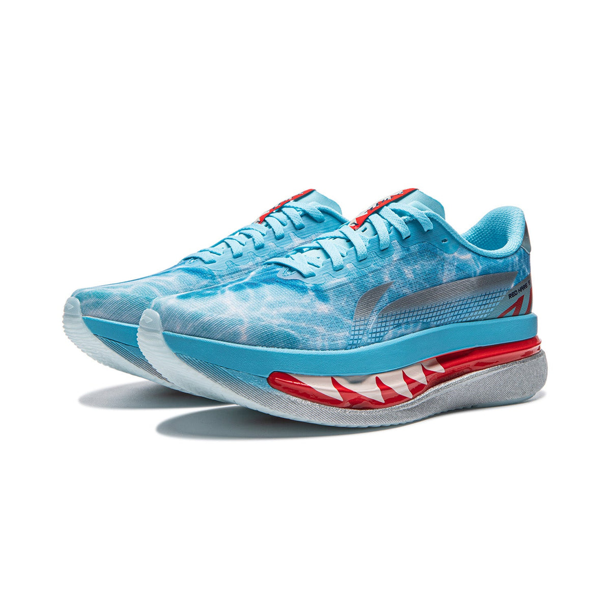Women's running shoes, angled view, bright water blue upper with red midsole accent