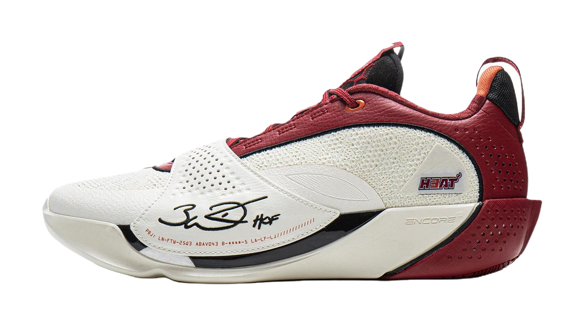 White and red basketball shoe with red laces, perforated side, and beige midsole
