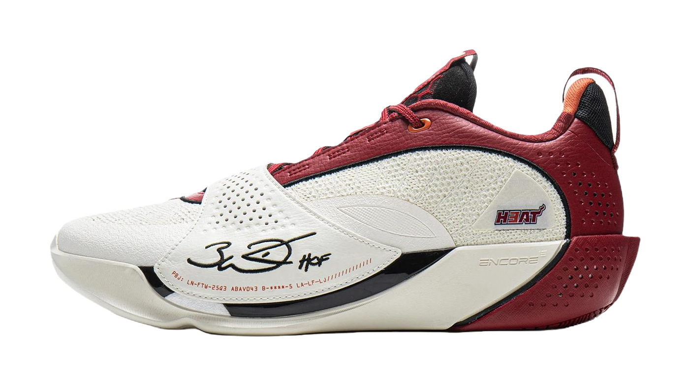 White and red basketball shoe with red laces, perforated side, and beige midsole