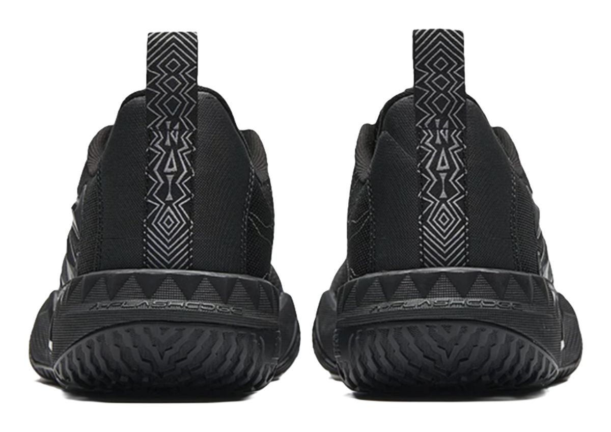 Black low-top basketball shoes, back view with sock-like collar and heel panel