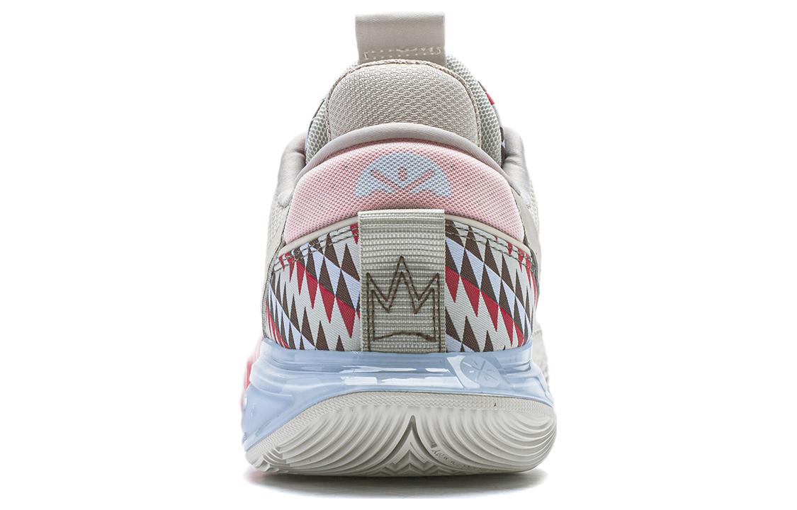Beige basketball shoes with pink heel accents, geometric side pattern, and light-blue outsole.