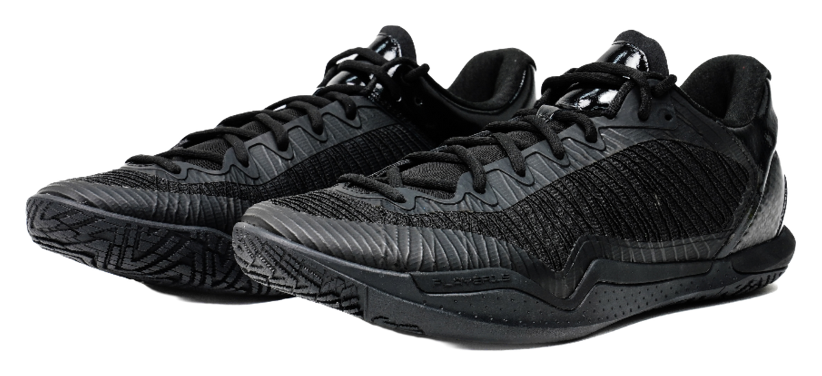 Black low-top basketball shoes, side-by-side view with lace and textured pattern.