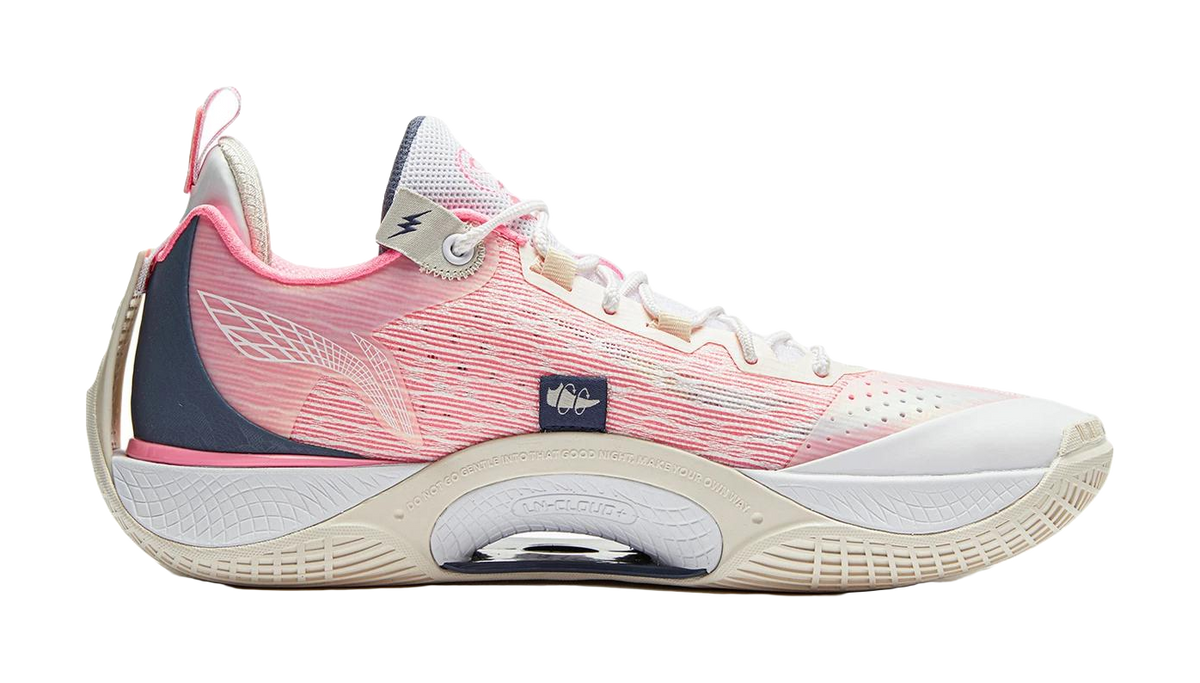 Basketball shoe with white and pink knit upper, dark blue heel trim, lace-up front