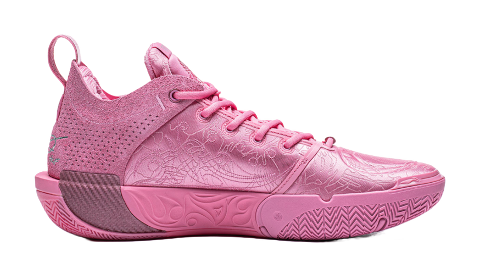 Pink basketball shoe side view with textured midsole and lace-up design