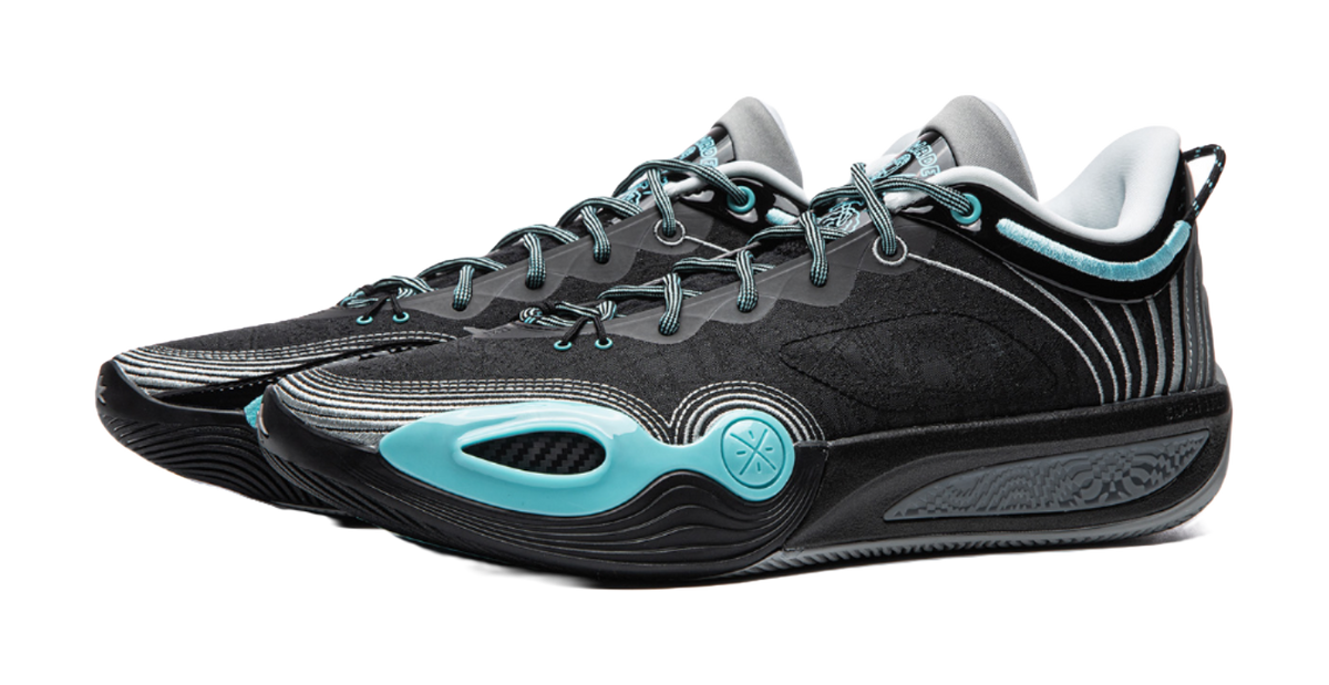 Black basketball shoe pair with teal details, round toe, and chunky sole