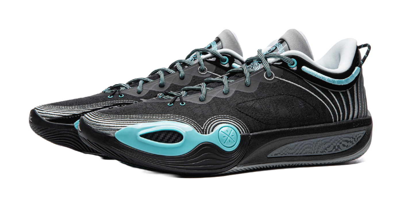 Black basketball shoe pair with teal details, round toe, and chunky sole