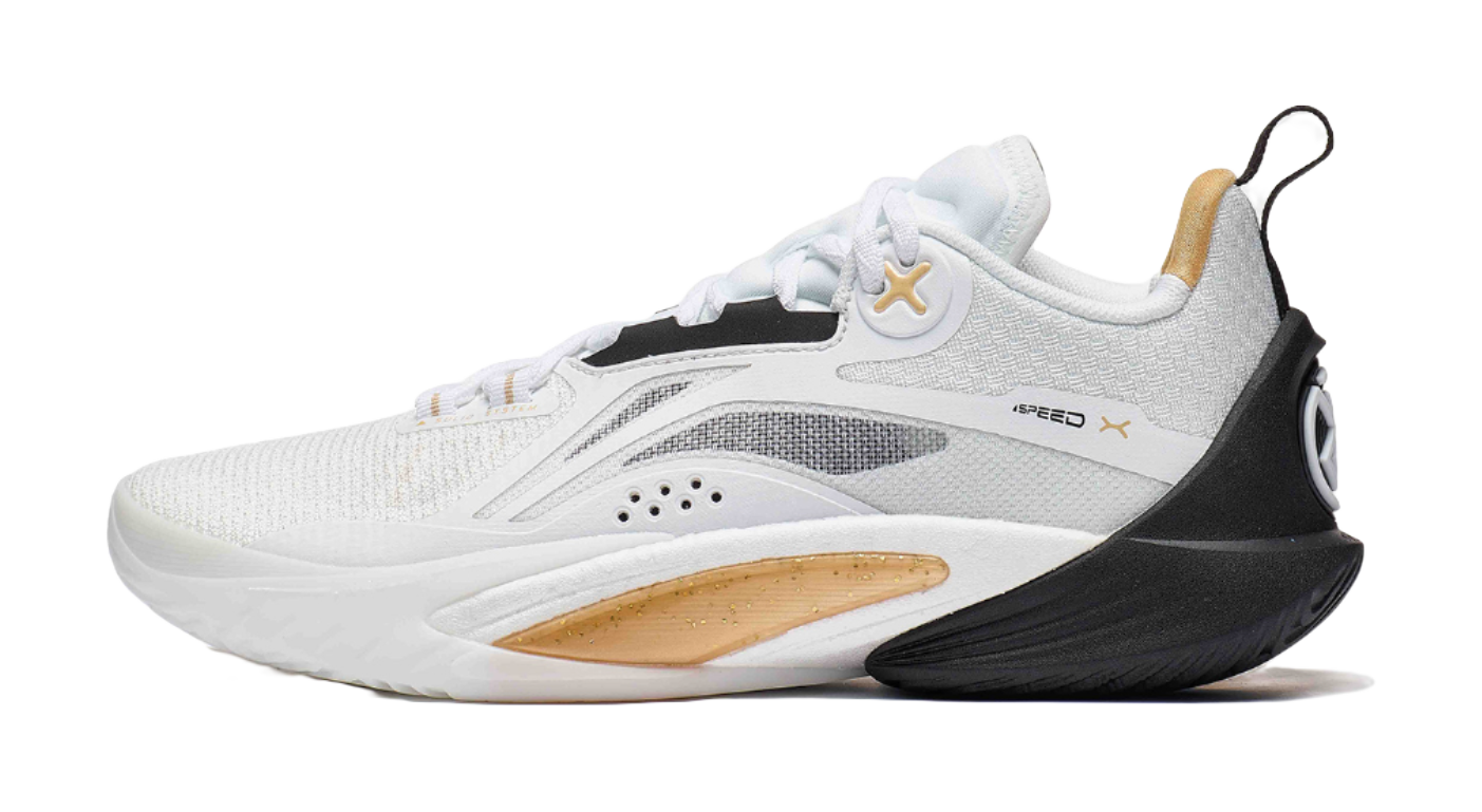 White and black basketball shoe with gold X logo at side, lace-up knit upper