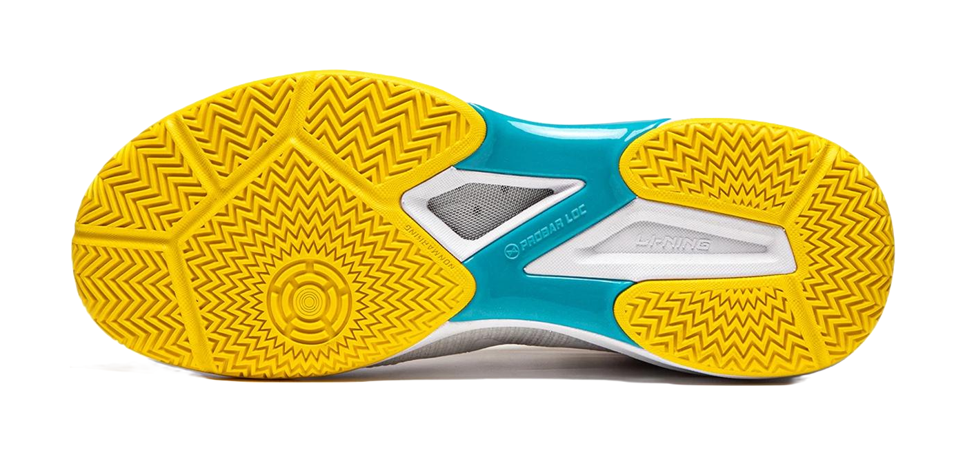 Table tennis shoe outsoles in yellow with zigzag tread and teal center panel
