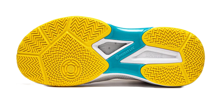Table tennis shoe outsoles in yellow with zigzag tread and teal center panel